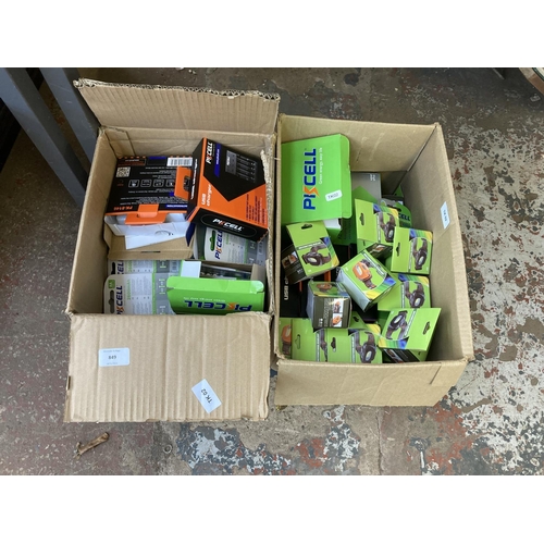 849 - Two boxes containing a large quantity of rechargeable batteries, boxed USB chargers and approx. twen... 