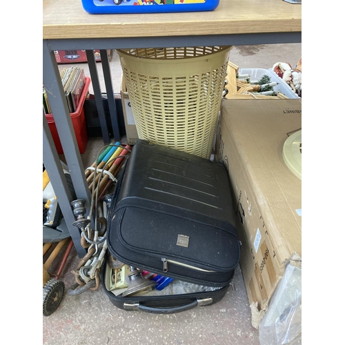 850 - A collection of items to include boxed cabinet, suitcase with contents, croquet mallets, packaged ho... 