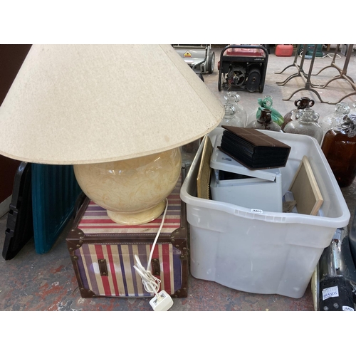 852 - A large collection of items to include wicker basket, stepladders, aluminium flight case, clock, cer... 