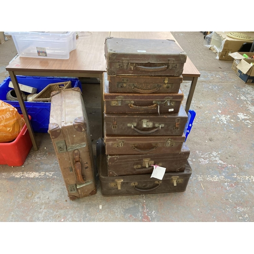 863 - Eight early 20th century leather suitcases