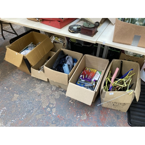 870 - Five boxes containing coat hangers, artists supplies and stationary, fabrics and sewing items