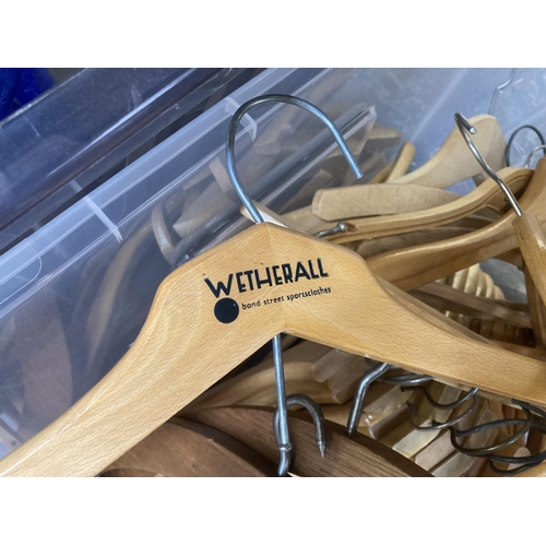 871 - A box containing wooden coat hangers to include some vintage examples