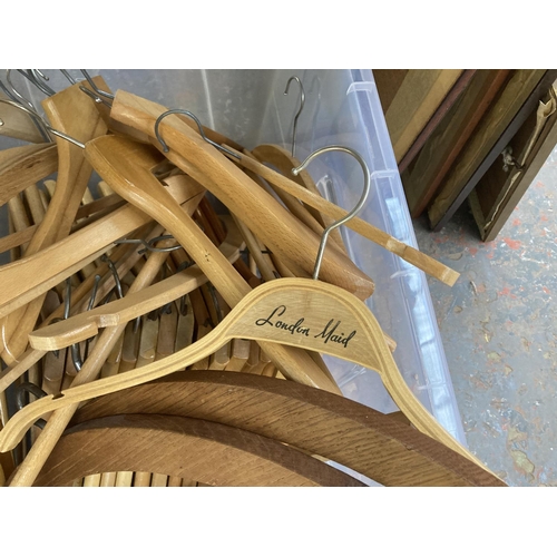 871 - A box containing wooden coat hangers to include some vintage examples