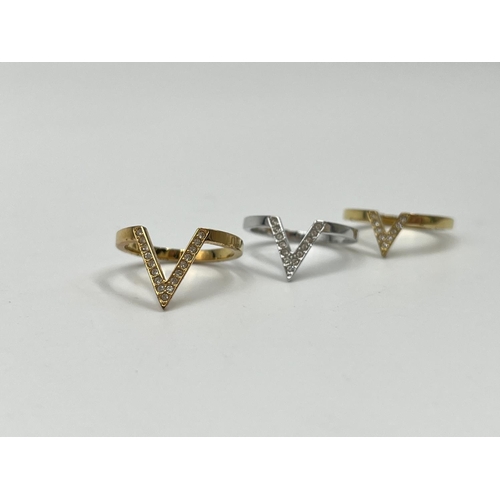 1076 - A boxed Swarovski Delta three piece graduating tri coloured V shaped ring set, size 52