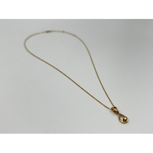 1078 - A 9ct gold and diamond 24cm pendant necklace - approx. gross weight 1.34 grams