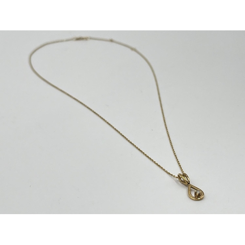 1078 - A 9ct gold and diamond 24cm pendant necklace - approx. gross weight 1.34 grams