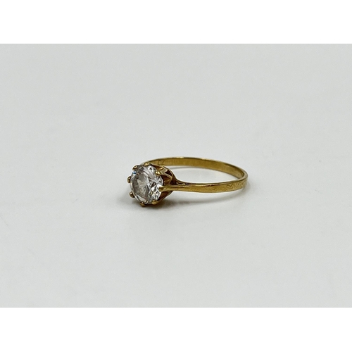 1081 - A hallmarked Birmingham 9ct gold and clear gemstone solitaire ring, size M - approx. gross weight 1.... 