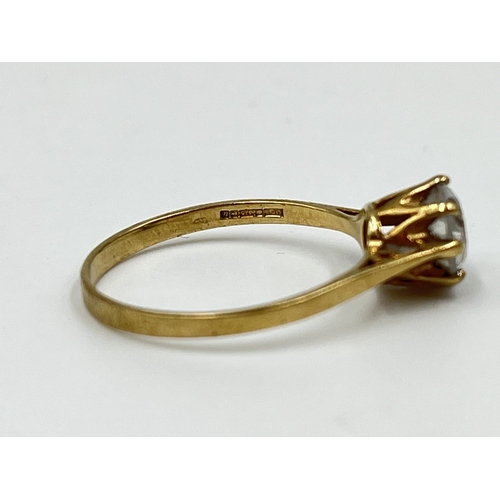 1081 - A hallmarked Birmingham 9ct gold and clear gemstone solitaire ring, size M - approx. gross weight 1.... 