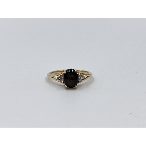 1082 - A hallmarked Birmingham 9ct gold black sapphire and moissanite shouldered ring, size O½ - approx. gr... 