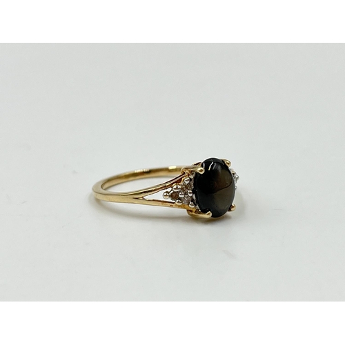 1082 - A hallmarked Birmingham 9ct gold black sapphire and moissanite shouldered ring, size O½ - approx. gr... 