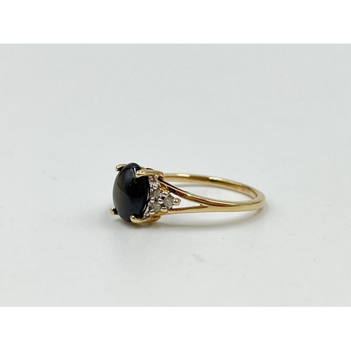 1082 - A hallmarked Birmingham 9ct gold black sapphire and moissanite shouldered ring, size O½ - approx. gr... 