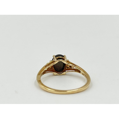 1082 - A hallmarked Birmingham 9ct gold black sapphire and moissanite shouldered ring, size O½ - approx. gr... 