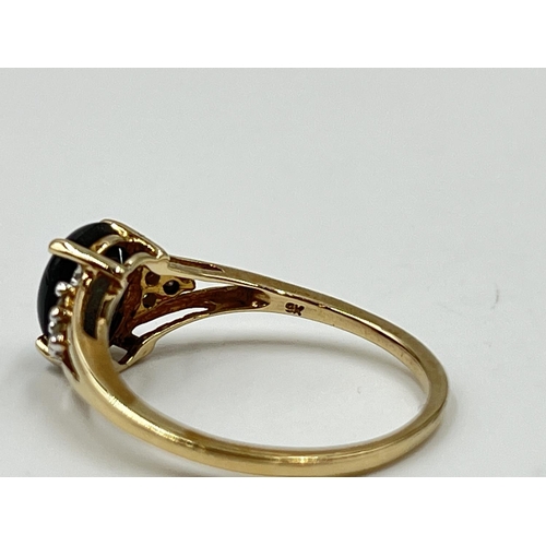 1082 - A hallmarked Birmingham 9ct gold black sapphire and moissanite shouldered ring, size O½ - approx. gr... 