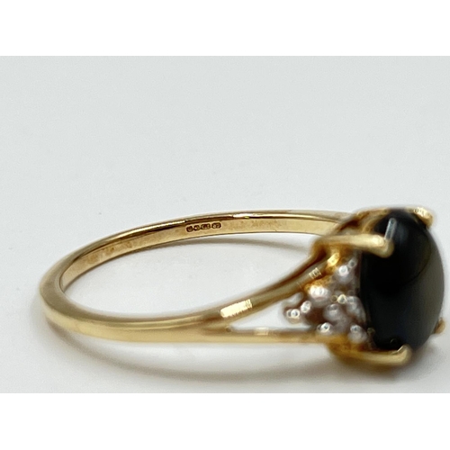 1082 - A hallmarked Birmingham 9ct gold black sapphire and moissanite shouldered ring, size O½ - approx. gr... 