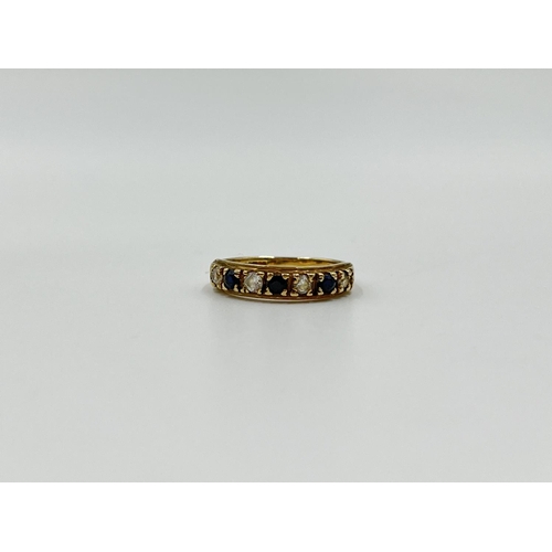 1093 - A hallmarked Birmingham 9ct gold sapphire and CZ ring, size K - approx. gross weight 1.64 grams