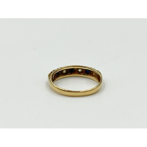 1093 - A hallmarked Birmingham 9ct gold sapphire and CZ ring, size K - approx. gross weight 1.64 grams