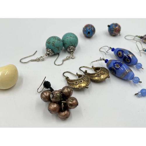 1100 - A collection of vintage earrings to include yellow metal Creole hoop, millefiori and cloisonné, blac... 