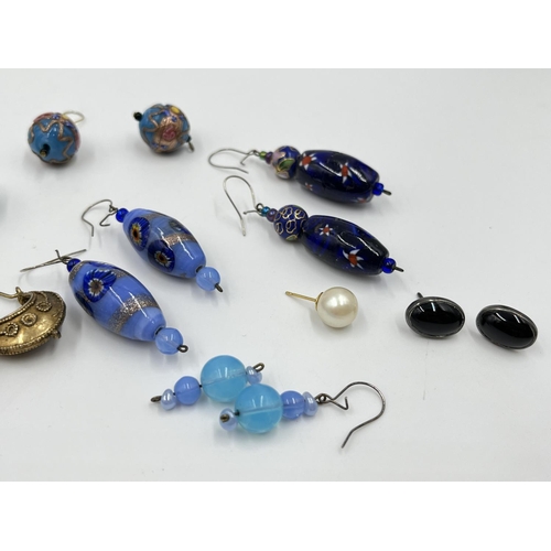 1100 - A collection of vintage earrings to include yellow metal Creole hoop, millefiori and cloisonné, blac... 