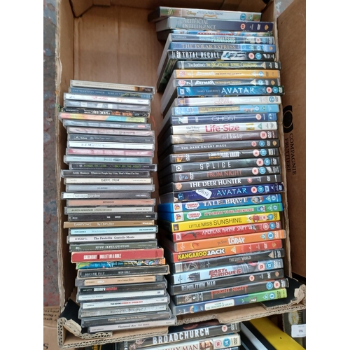 760 - Five boxes containing a collection of CDs and DVDs; sealed DVDs to include Take That, Mrs Doubtfire,... 