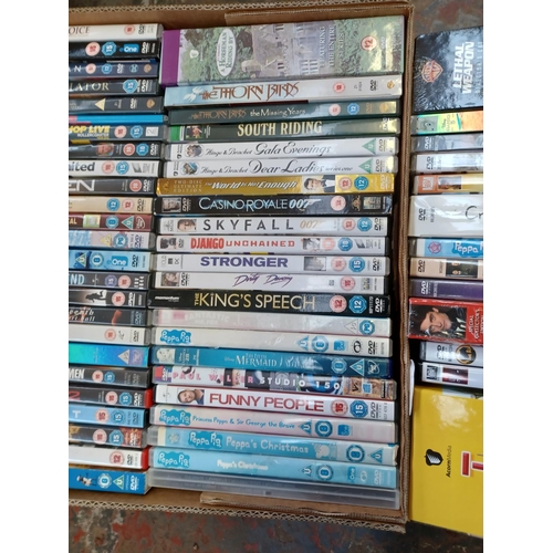 764 - One box containing a collection of DVDs; sealed titles to include Logan, Deadpool, Peter Kay's Phoen... 