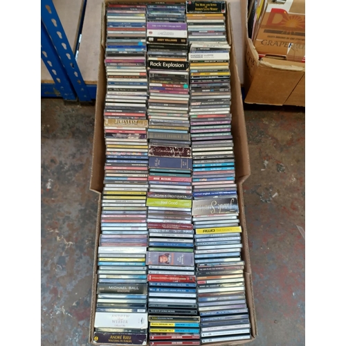 765 - A box containing a collection of CDs - see images for titles