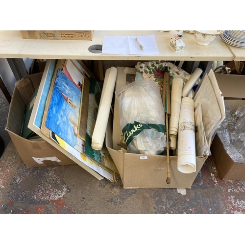 888 - Two boxes containing a large quantity of unframed pictures, books, parasol etc.