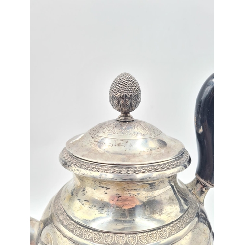 1266 - An antique white metal coffee pot with acorn finial, dog head spout and stamped with eagle mark to b... 