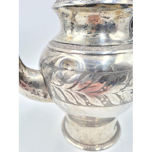 1266 - An antique white metal coffee pot with acorn finial, dog head spout and stamped with eagle mark to b... 