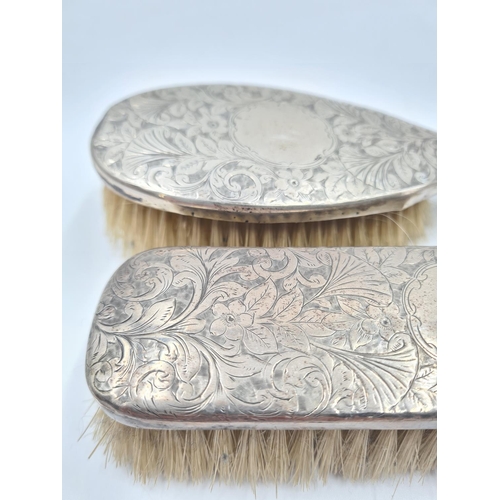 1267 - Two antique white metal backed brushes