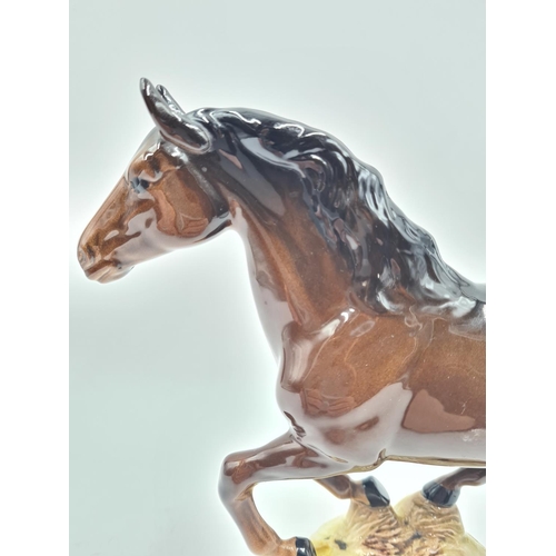 196 - A Beswick galloping horse figurine, model no. 1374 - approx. 18cm high x 24cm long