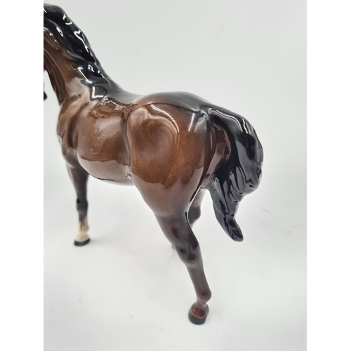 199 - A Beswick horse figurine - approx. 19cm high x 20cm long