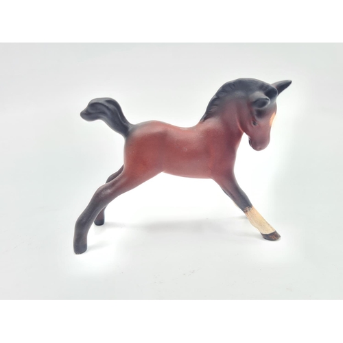 201 - Three Beswick figurines, two foals and one Shetland pony - largest approx. 12cm high