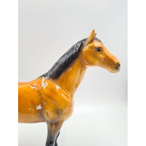 202 - A ceramic 24cm horse figurine