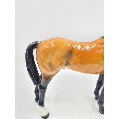 202 - A ceramic 24cm horse figurine