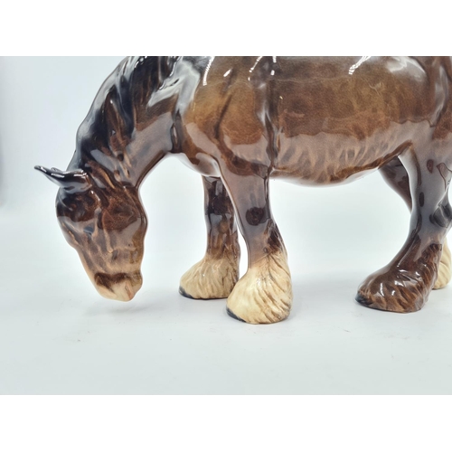 203 - A Beswick grazing horse figurine - approx. 14cm high