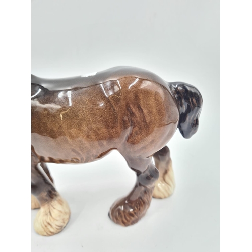 203 - A Beswick grazing horse figurine - approx. 14cm high