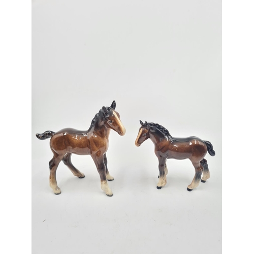 204 - Five Beswick foal figurines - largest approx. 15.5cm high