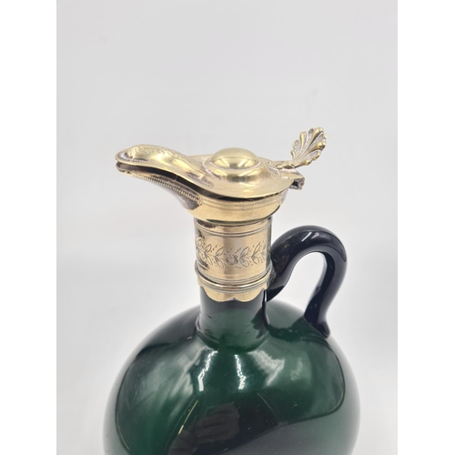 227 - A green glass and silver plate claret jug - approx. 21cm high