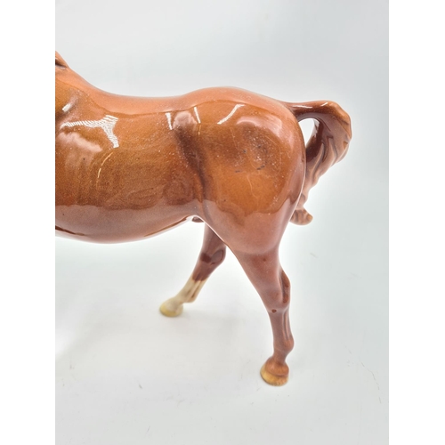 246B - A Beswick horse figurine - approx. 19cm high x 20cm long