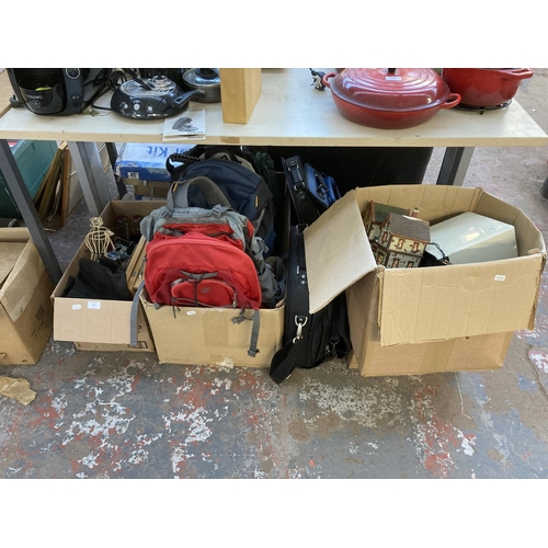 903 - Three boxes containing backpacks, laptop bags, mixed electrical items, book stands, compacts, Kilner... 