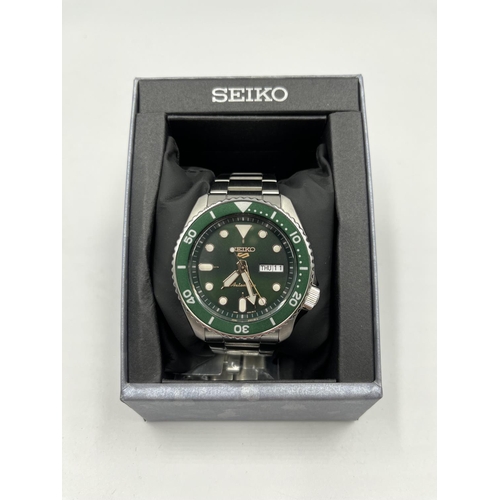 1174 - A boxed Seiko 5 Sports automatic 42mm men's wristwatch with original tags, spare links, guarantee an... 