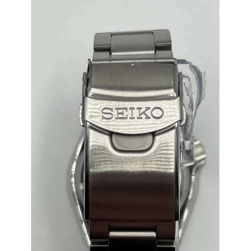 1174 - A boxed Seiko 5 Sports automatic 42mm men's wristwatch with original tags, spare links, guarantee an... 