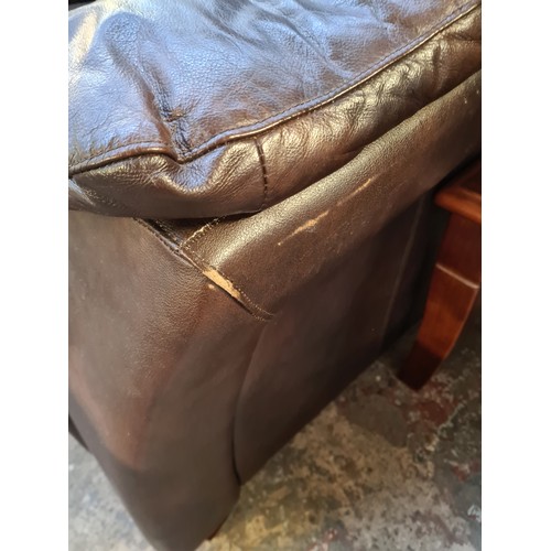 61 - A pair of SCS brown leather armchairs - approx. 90cm high x 116cm wide x 95cm deep