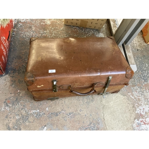 885 - An early 20th century Revelation brown leather suitcase