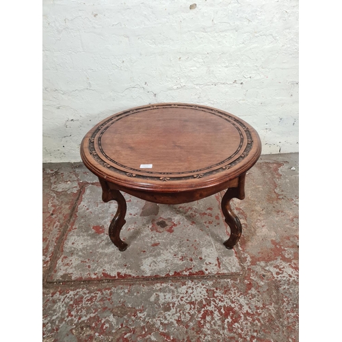 23 - An Anglo Indian style carved mahogany circular side table - approx. 41cm high x 69cm diameter