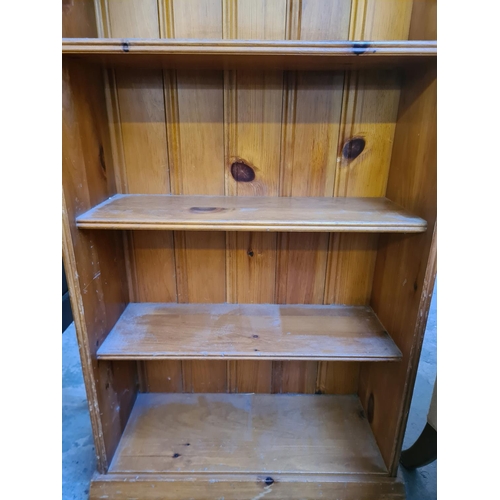 15 - A modern pine four tier bookcase - approx. 107cm high x 61cm wide x 25cm deep