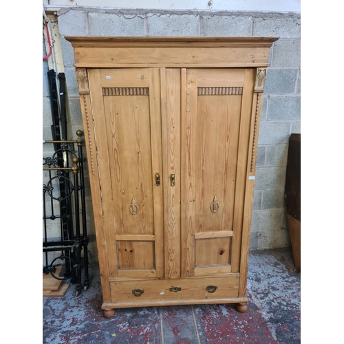 2 - A Victorian style solid pine double wardrobe with lower drawer - approx. 194cm high x 116cm wide x 6... 