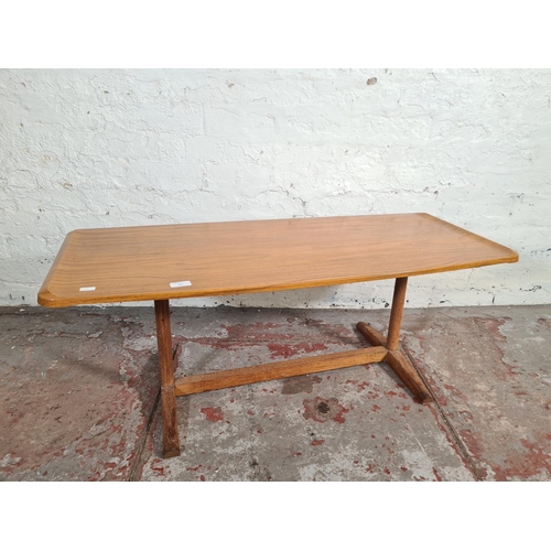 24 - A mid 20th century teak effect rectangular coffee table - approx. 40cm high x 46cm wide x 107cm long