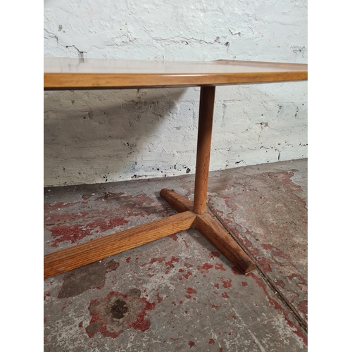 24 - A mid 20th century teak effect rectangular coffee table - approx. 40cm high x 46cm wide x 107cm long