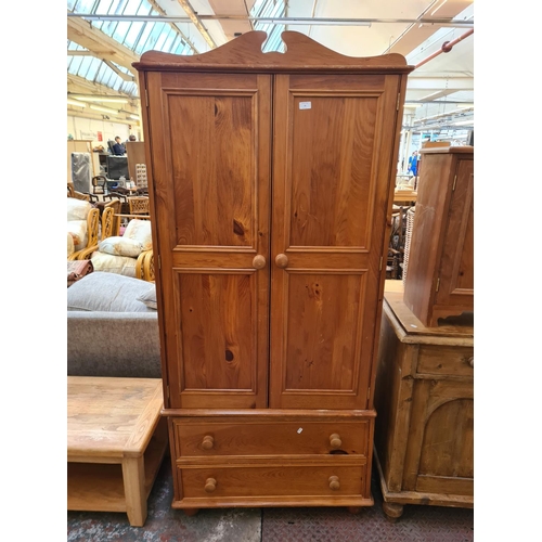 26 - A modern pine double wardrobe with two lower drawers - approx. 199cm high x 91cm wide x 54cm deep